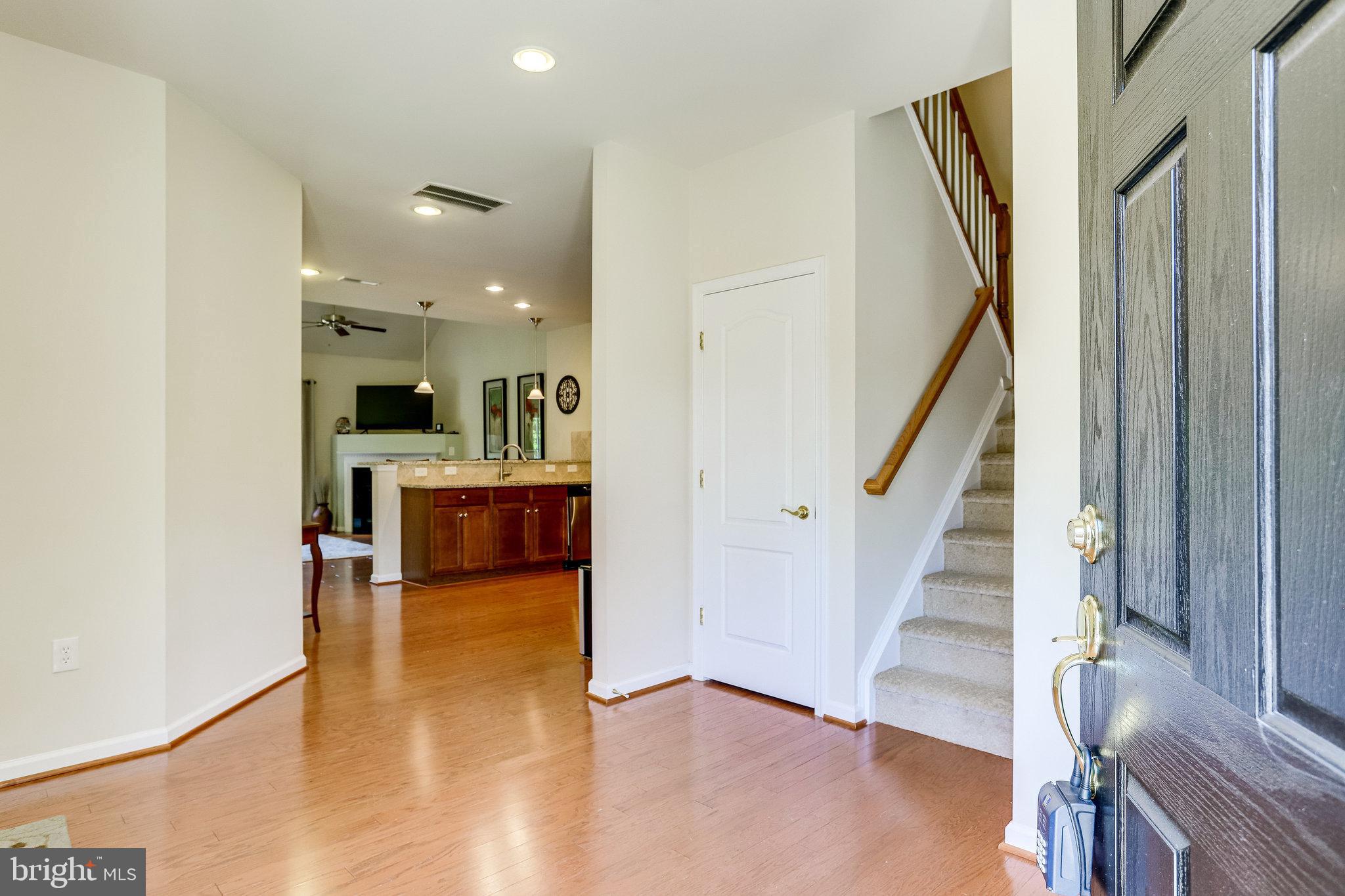 44320 McHenry Square Ashburn, VA 20147 - Photo 54 of 55 Open floor plan with gleaming hardwood floors
