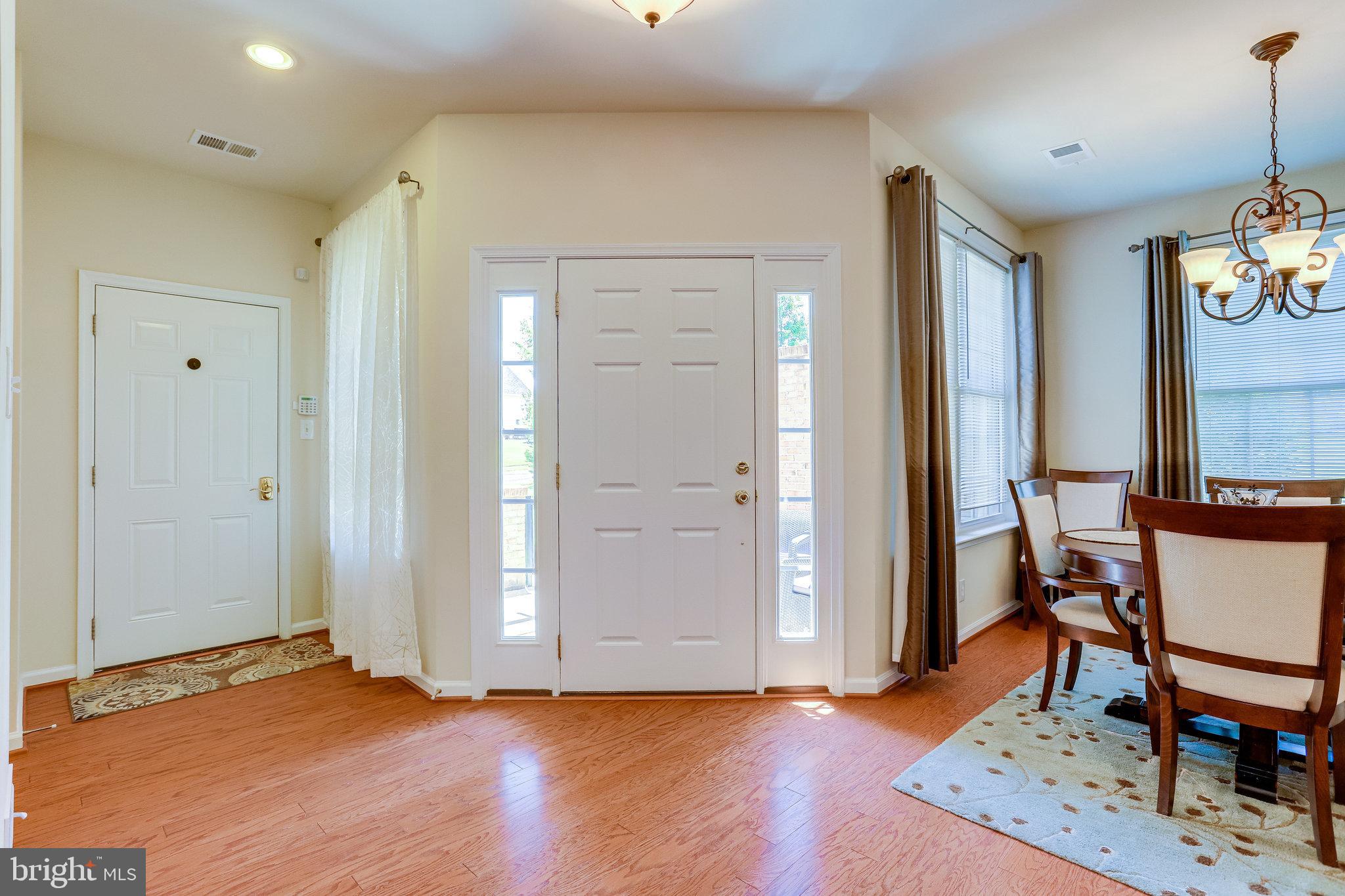 44320 McHenry Square Ashburn, VA 20147 - Photo 5 of 55 Front door has side transoms