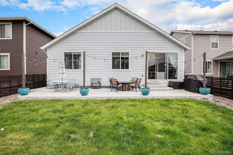 a front view of house with yard and outdoor seating