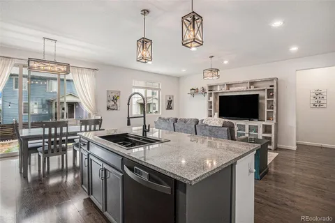 a kitchen with stainless steel appliances granite countertop a stove and a sink