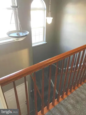 a workspace with furniture and a large window