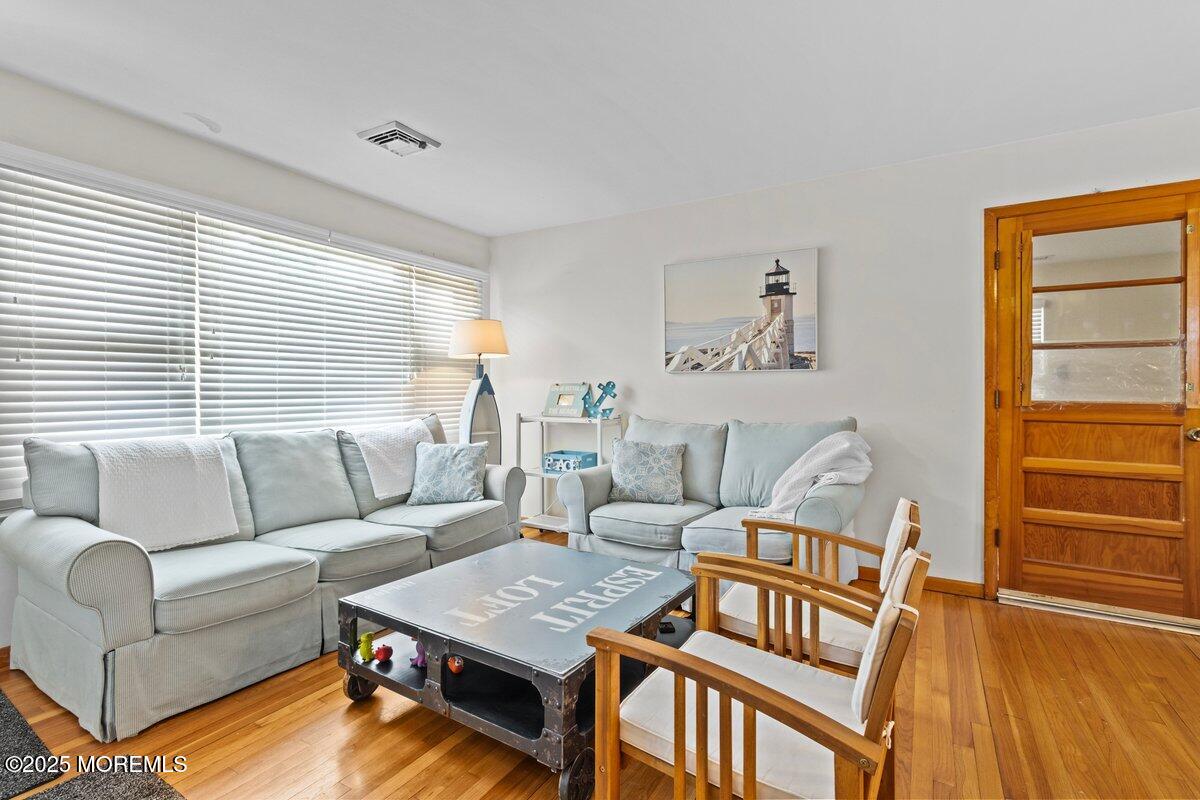 100 3rd Avenue Lavallette, NJ 08735 - Photo 4 of 39 a living room with furniture and a window