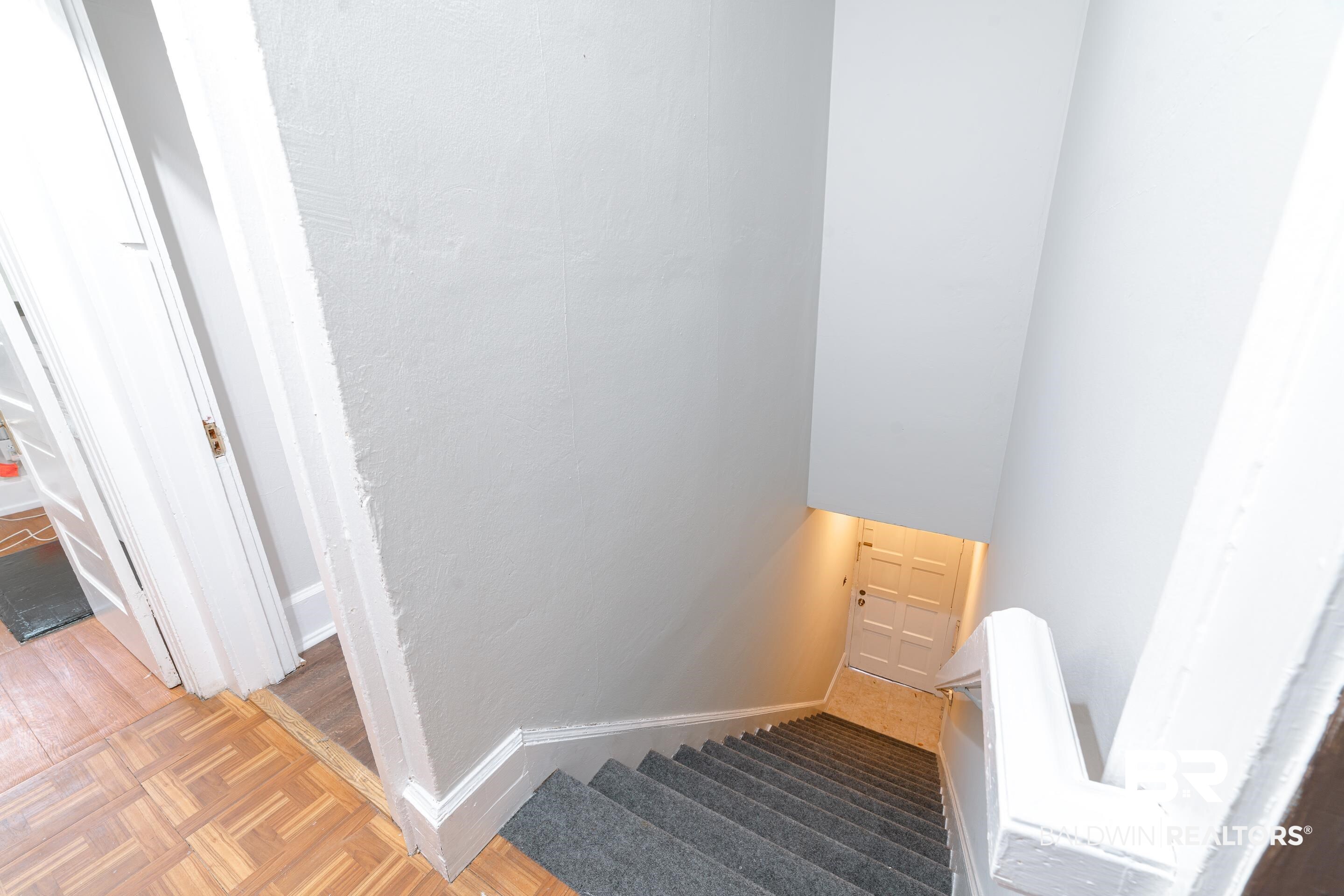 312 1st Street Mobile, AL 36611 - Photo 14 of 29 Staircase featuring hardwood / wood-style floors