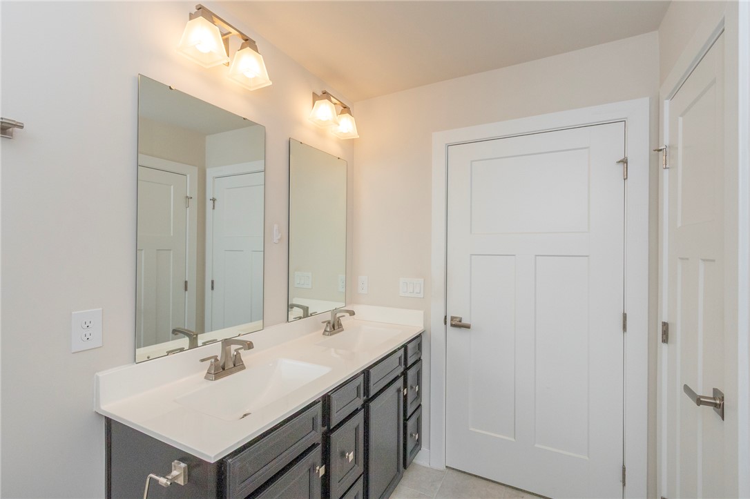233 Scenic Road Anderson, SC 29621 - Photo 31 of 50 A sleek double vanity with ample counter space creates a functional and pleasing primary bathroom.