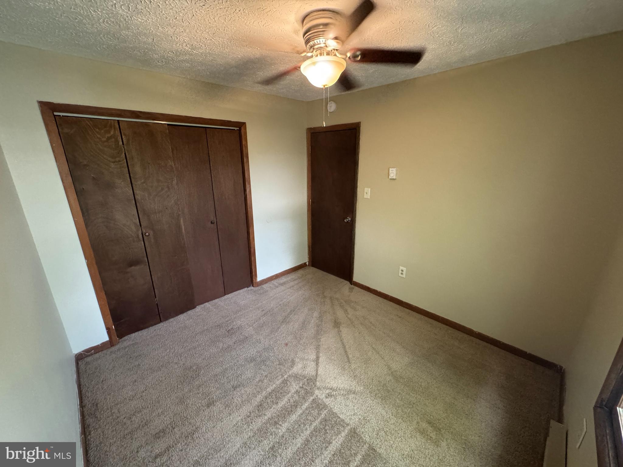 512 Allston Circle Winchester, VA 22601 - Photo 12 of 15 a view of empty room with fan and window