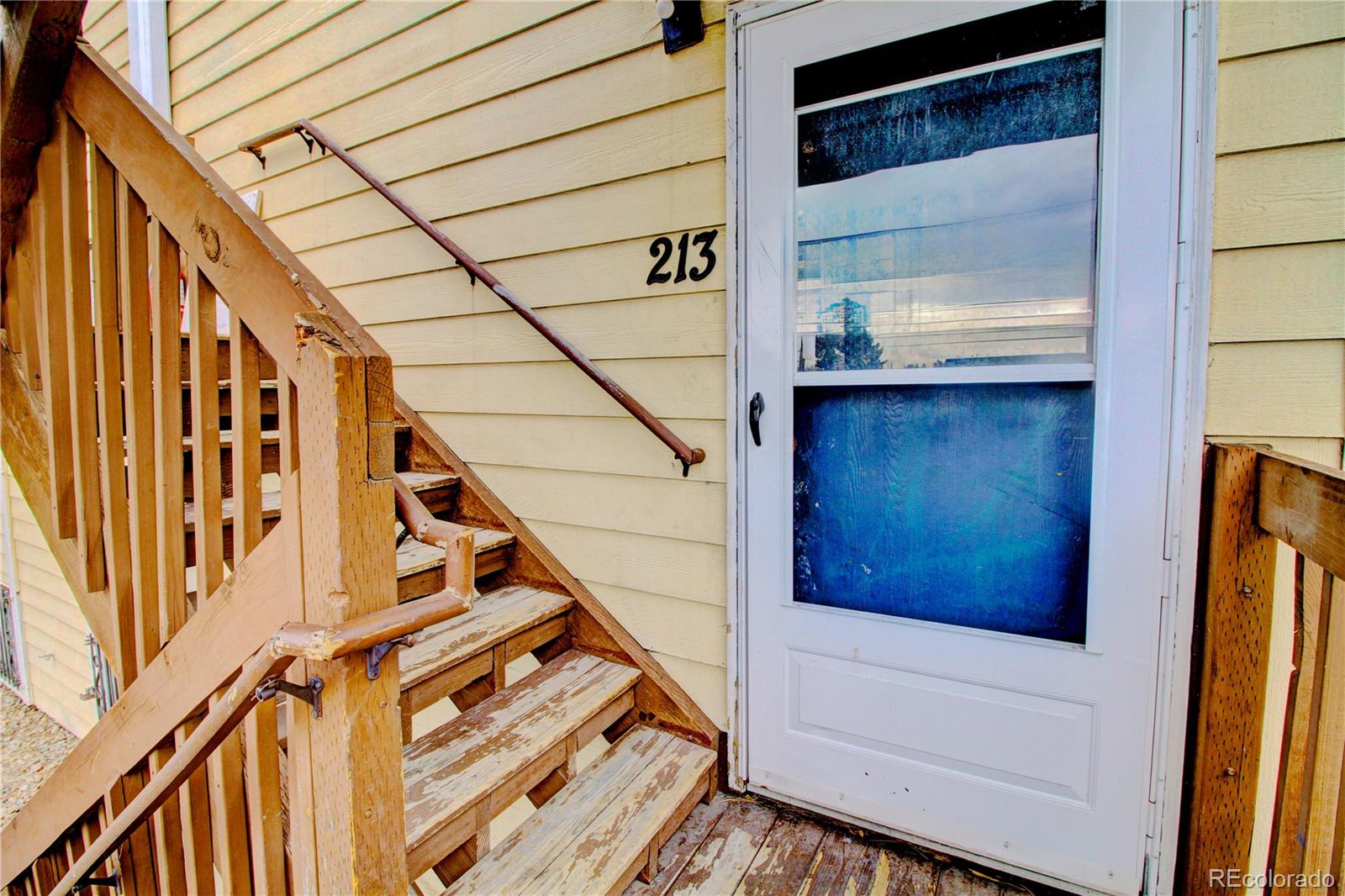 9340 West 49th Avenue, Unit 213 Wheat Ridge, CO 80033 - Photo 3 of 16 a view of entryway with a front door