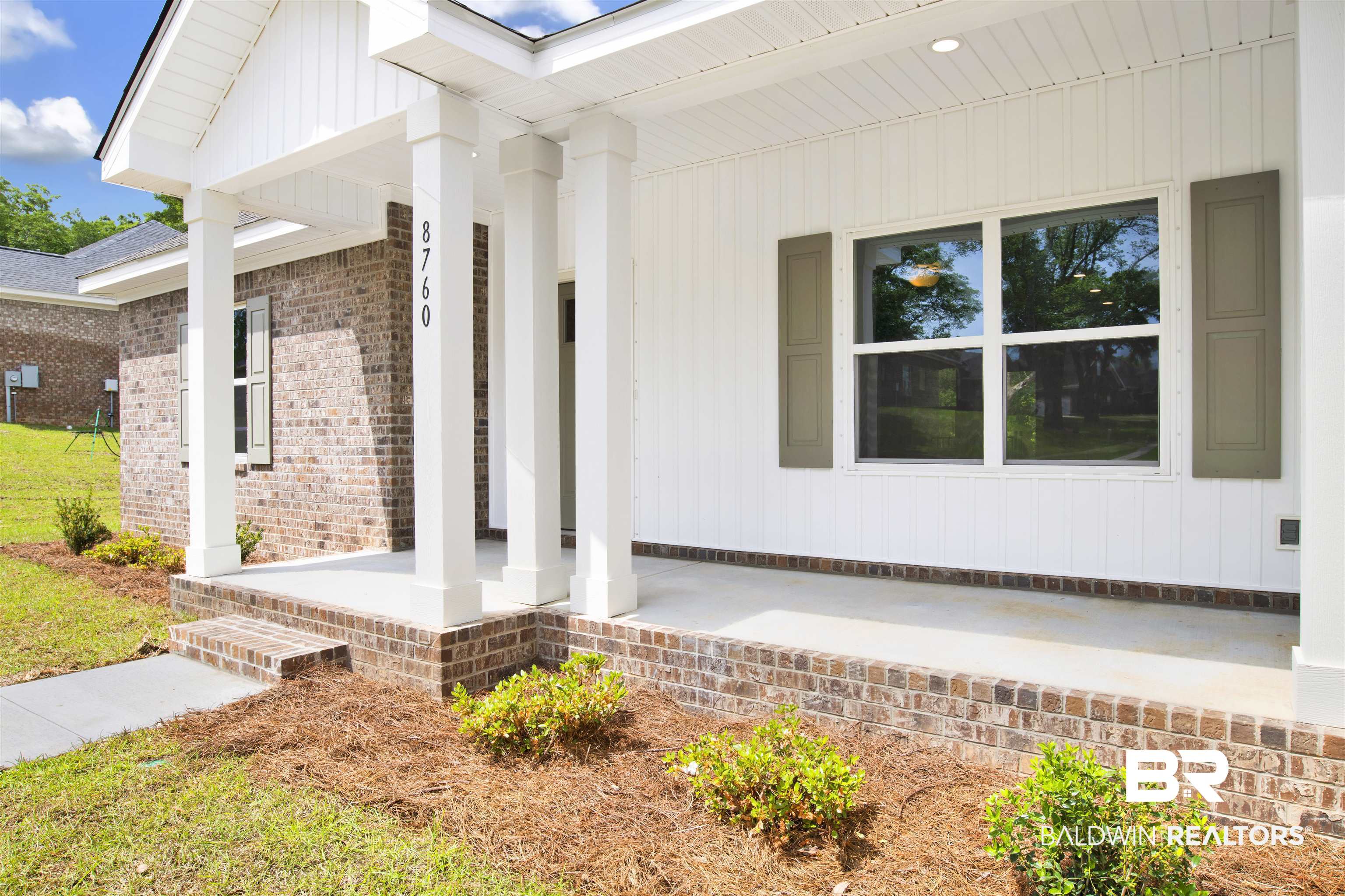 8760 Floyd Crabtree Way Semmes, AL 36575 - Photo 2 of 34 Front porch with brick foundation and concrete flooring