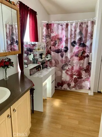 a kitchen with a sink a stove and cabinets