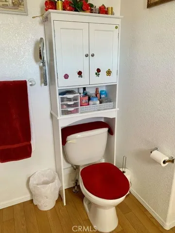 a bathroom with a toilet and a sink