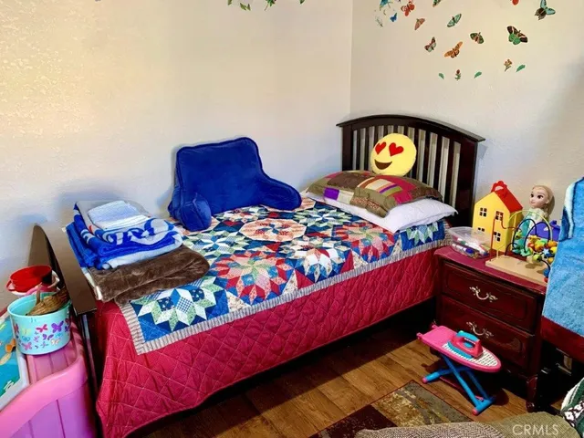 a bedroom with two beds and a couch