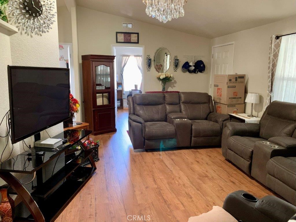 33600 Calimesa Boulevard, Unit 141 Yucaipa, CA 92399 - Photo 9 of 23 a living room with furniture and a flat screen tv