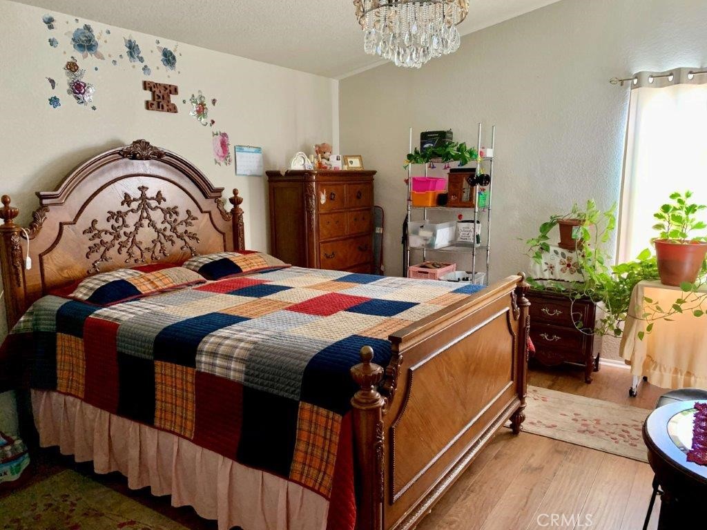 33600 Calimesa Boulevard, Unit 141 Yucaipa, CA 92399 - Photo 10 of 23 a bedroom with a bed and a dresser in it