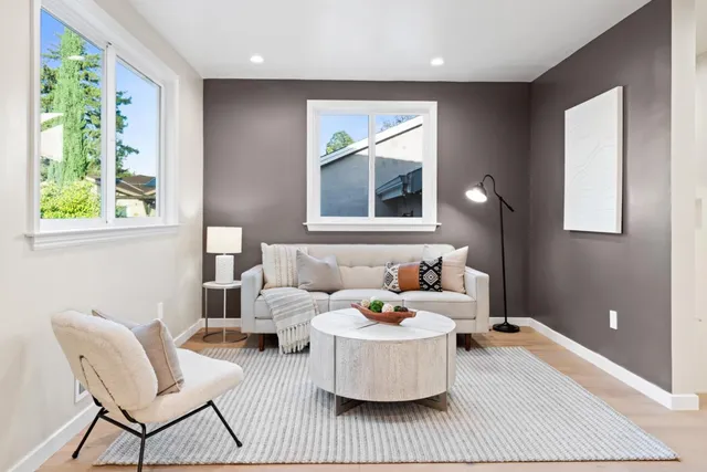 a bedroom with furniture and a window