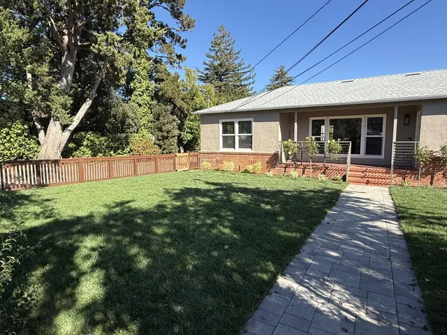 a front view of house with yard patio and green space