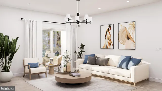 a living room with furniture potted plant a window and a flat screen tv