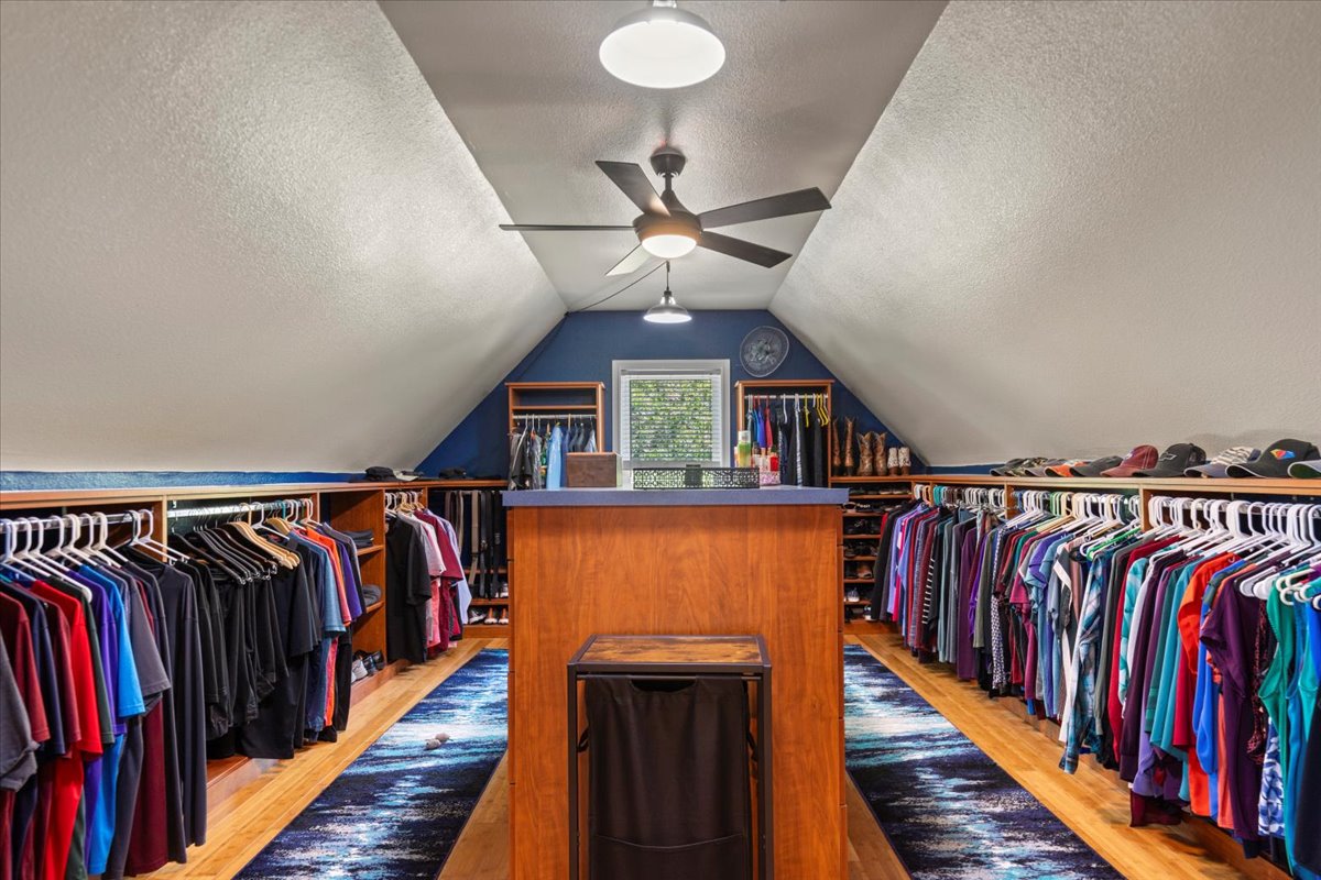 550 League Line Road Smithville, TX 78957 - Photo 26 of 40 a view of walk in closet with clothes and shoes