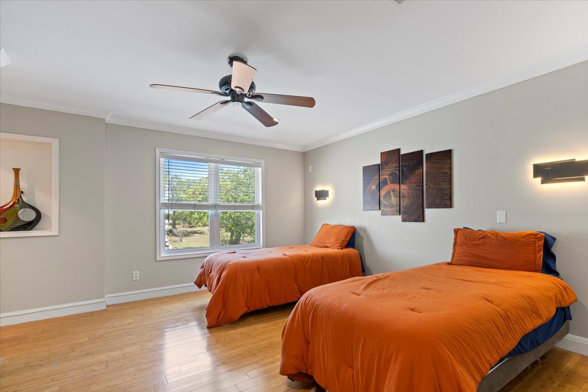 550 League Line Road Smithville, TX 78957 - Photo 27 of 40 a bedroom with two beds and a window