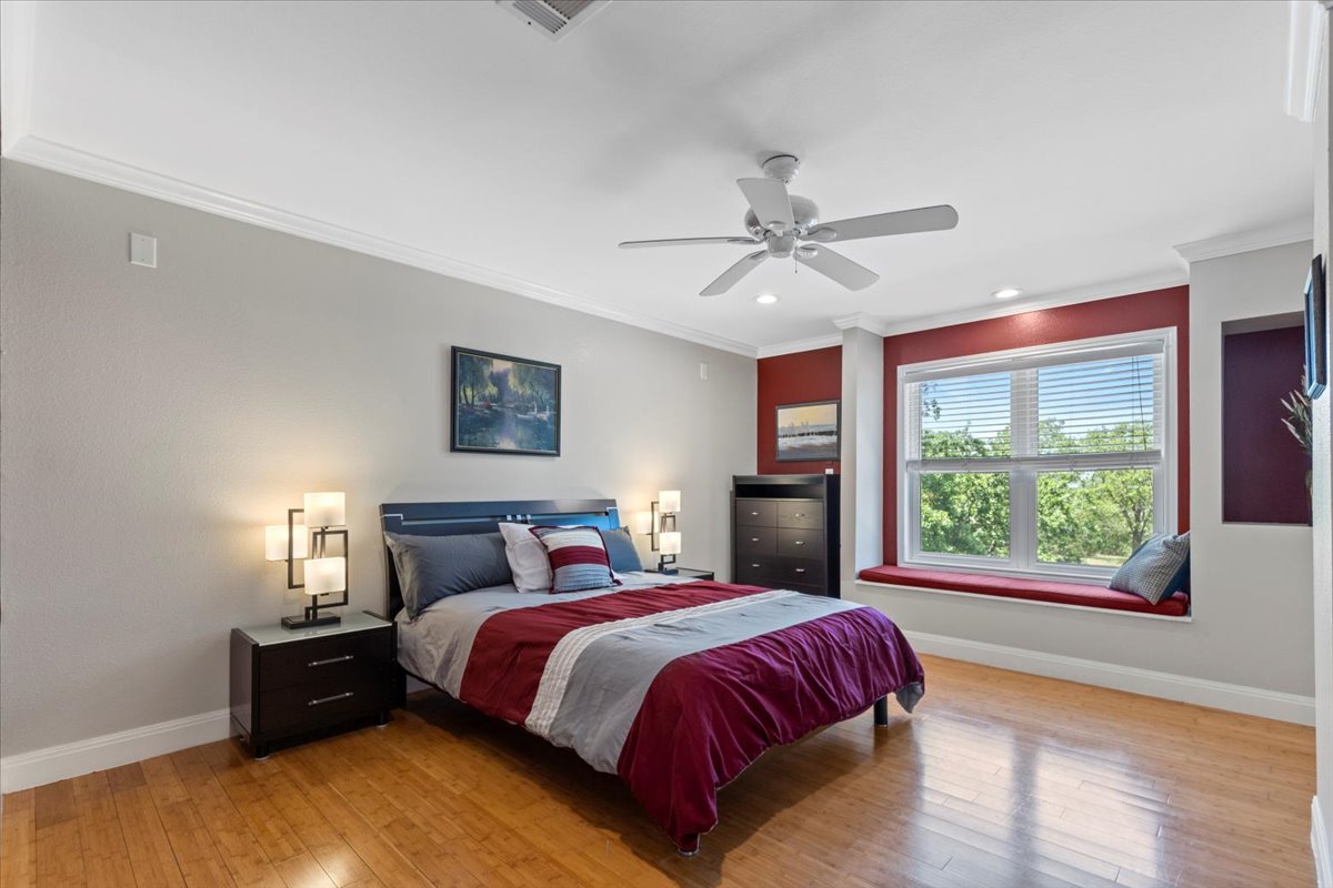 550 League Line Road Smithville, TX 78957 - Photo 30 of 40 a bedroom with a large bed and a large window