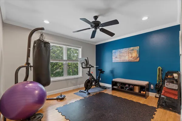 a room with gym equipment and a large window