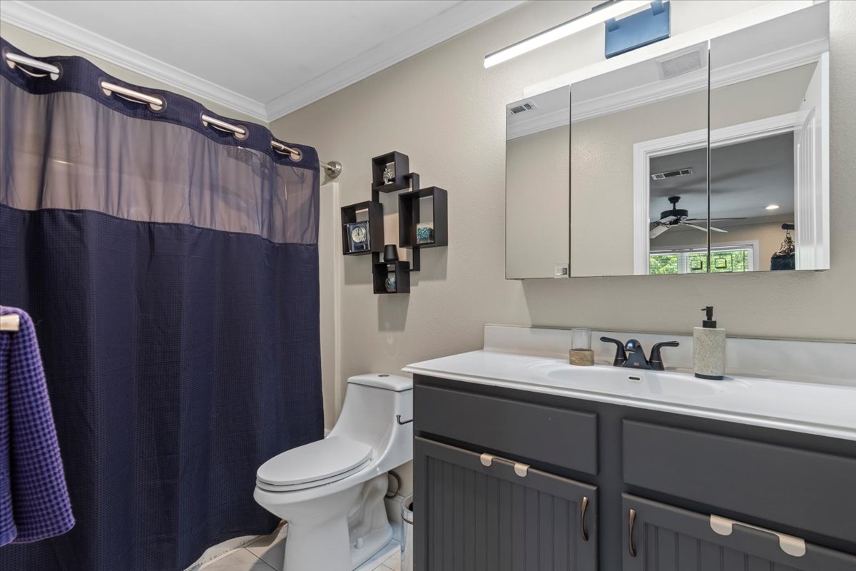 550 League Line Road Smithville, TX 78957 - Photo 33 of 40 a bathroom with a sink toilet and mirror