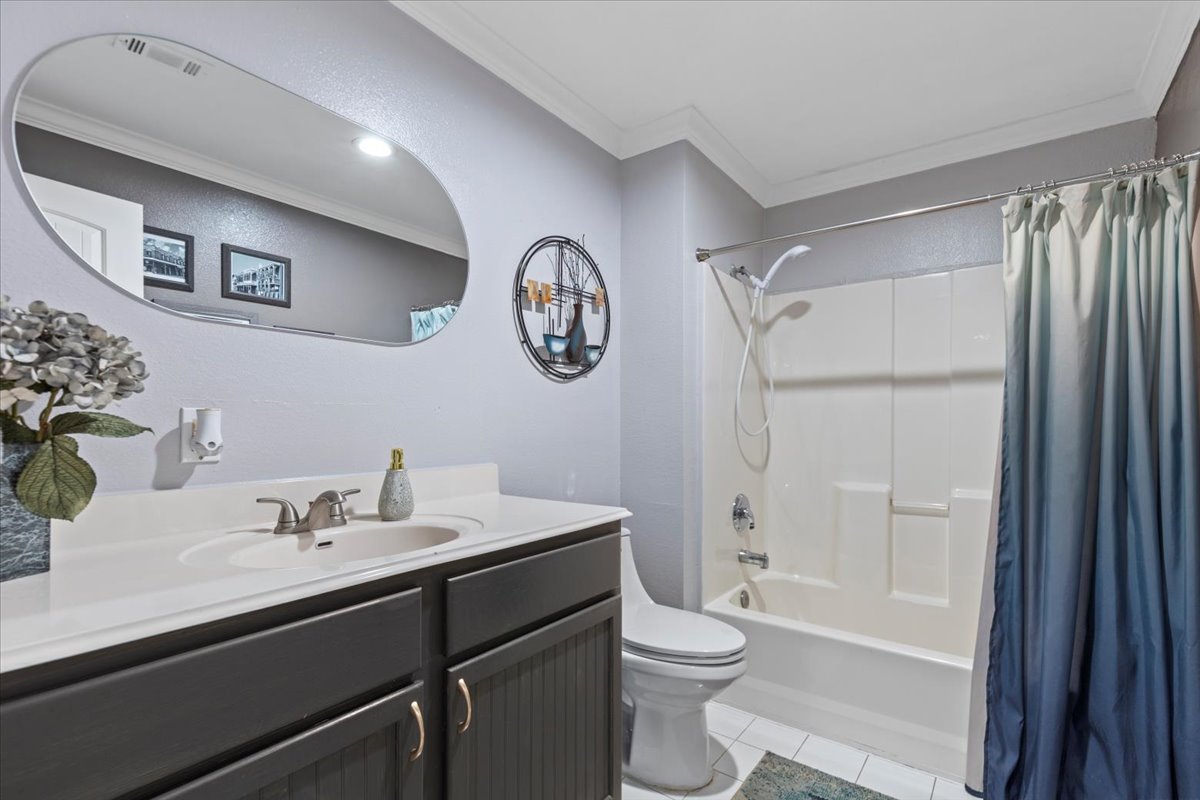 550 League Line Road Smithville, TX 78957 - Photo 36 of 40 a bathroom with a sink a toilet and a large mirror