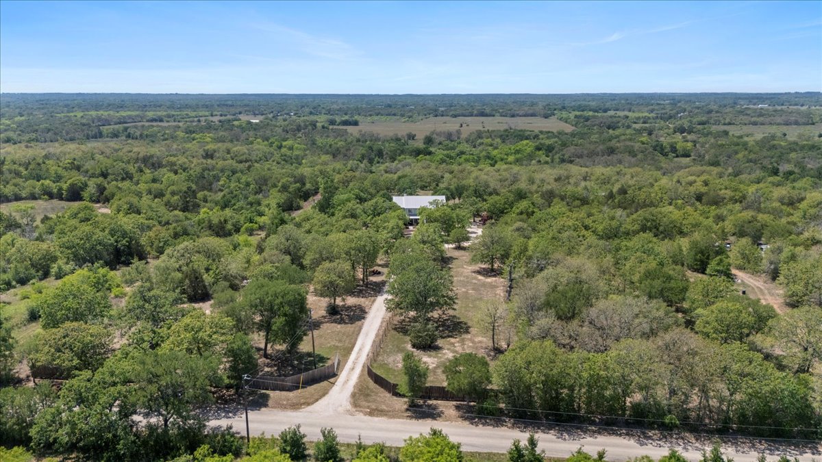 550 League Line Road Smithville, TX 78957 - Photo 37 of 40 a view of a forest with a street