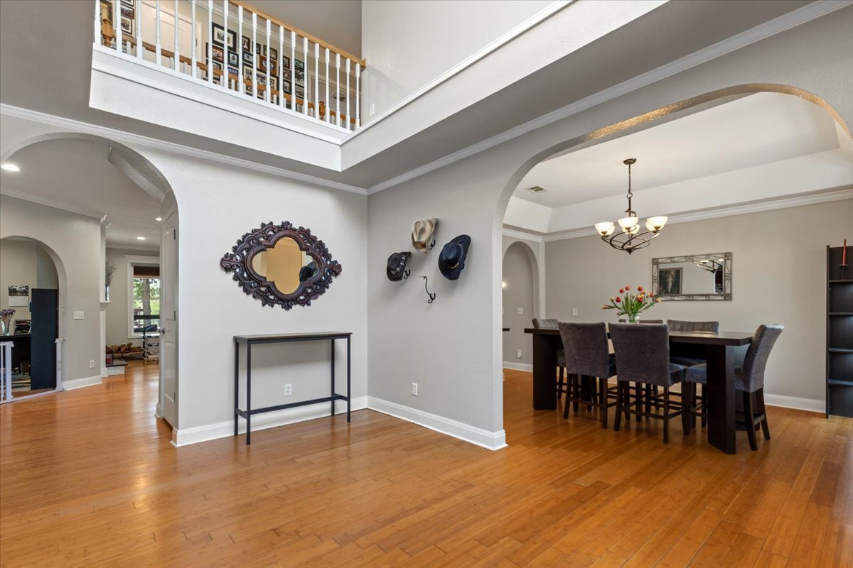 550 League Line Road Smithville, TX 78957 - Photo 7 of 40 a view of a dining room with furniture chandelier and wooden floor