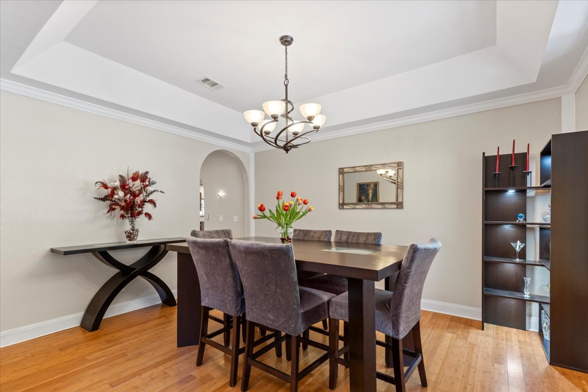 550 League Line Road Smithville, TX 78957 - Photo 9 of 40 a view of a dining room with furniture and wooden floor