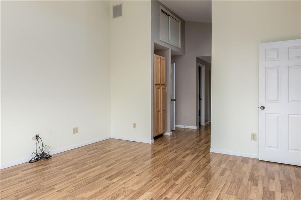 292 Blaker Ridge Road Waynesburg, PA 15370 - Photo 11 of 25 a view of a room with wooden floor and a ceiling fan