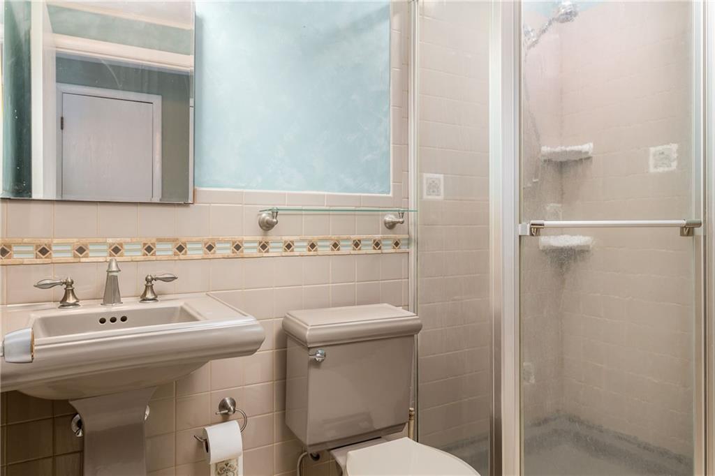 292 Blaker Ridge Road Waynesburg, PA 15370 - Photo 16 of 25 a bathroom with a sink a toilet and mirror