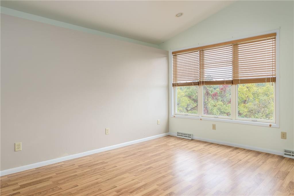 292 Blaker Ridge Road Waynesburg, PA 15370 - Photo 10 of 25 an empty room with wooden floor and windows