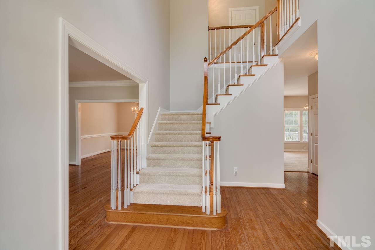8208 Manatee Court Raleigh, NC 27616 - Photo 2 of 30 a view of entryway and hall with wooden floor