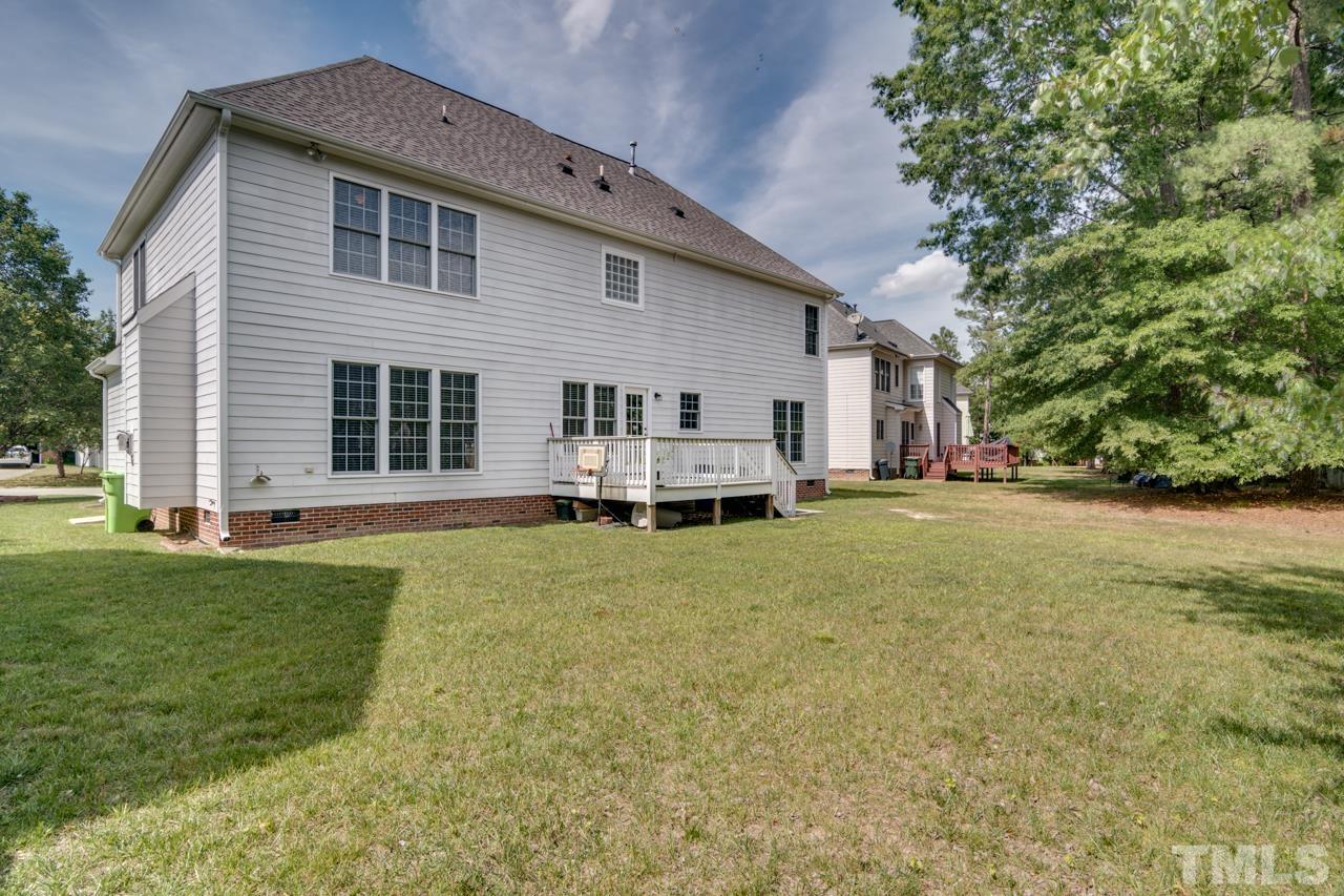 8208 Manatee Court Raleigh, NC 27616 - Photo 25 of 30 a backyard of a house with table and chairs