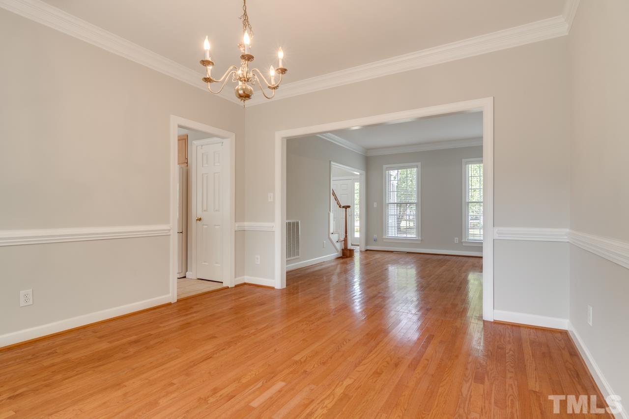 8208 Manatee Court Raleigh, NC 27616 - Photo 5 of 30 a view of livingroom with hallway and wooden floor