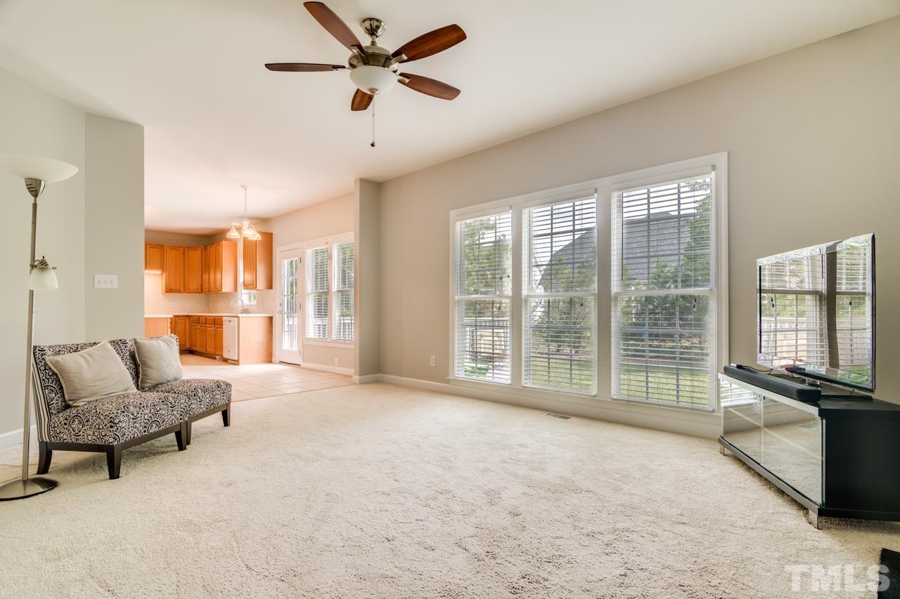 8208 Manatee Court Raleigh, NC 27616 - Photo 10 of 30 a living room with furniture and a large window