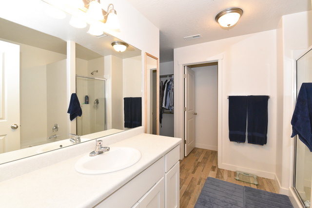 1632 North Apache Road Saratoga Springs, UT 84045 - Photo 18 of 28 Bathroom vanity with an integrated sink and chrome faucet