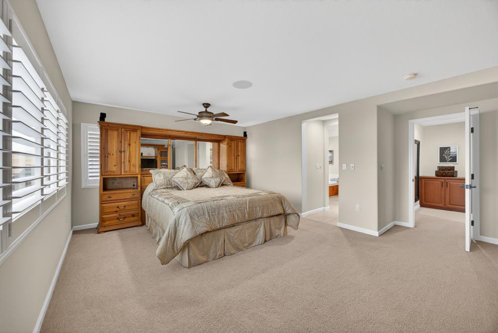 3670 Topaz Road West Sacramento, CA 95691 - Photo 20 of 97 a spacious bedroom with a bed and a large window