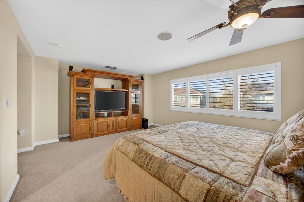 3670 Topaz Road West Sacramento, CA 95691 - Photo 21 of 97 a bedroom with a large bed and a flat screen tv