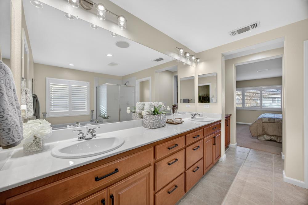3670 Topaz Road West Sacramento, CA 95691 - Photo 23 of 97 a spacious bathroom with a double vanity sink and a mirror