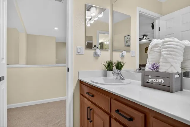 a dining room with furniture a chandelier and window