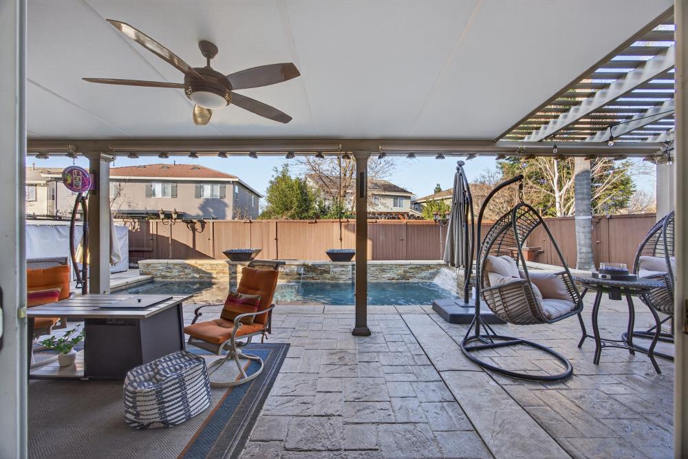 3670 Topaz Road West Sacramento, CA 95691 - Photo 48 of 97 a living room with a patio furniture and a floor to ceiling window