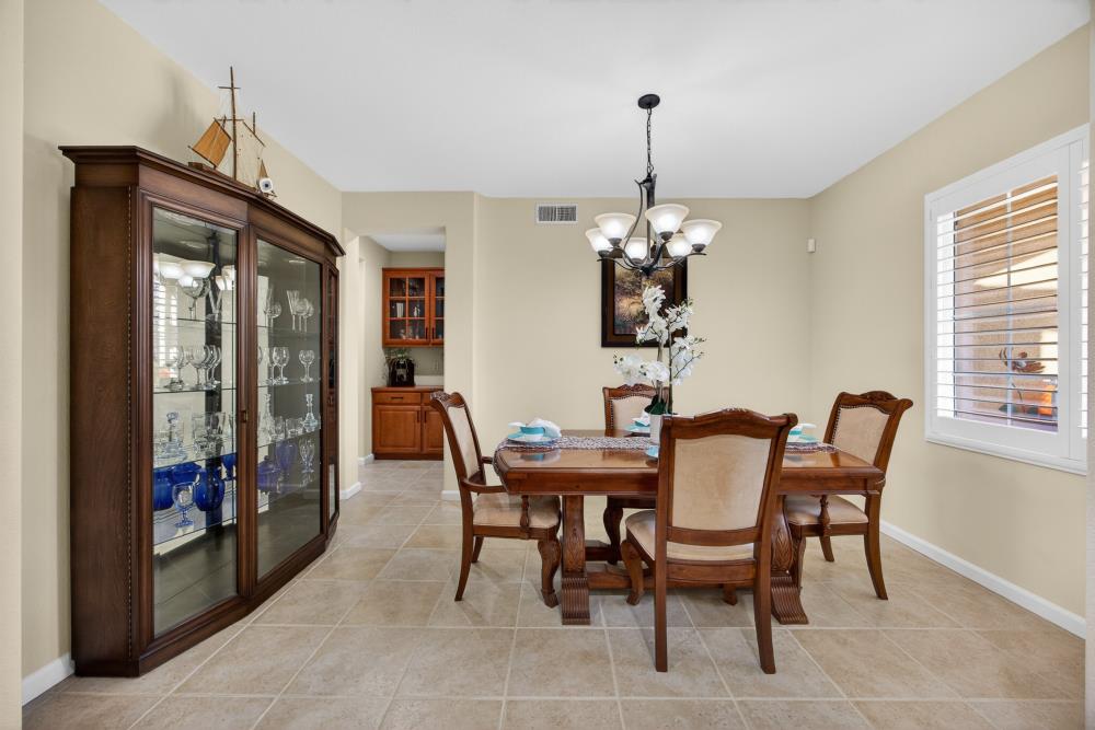 3670 Topaz Road West Sacramento, CA 95691 - Photo 63 of 97 a dining room with furniture a chandelier and window