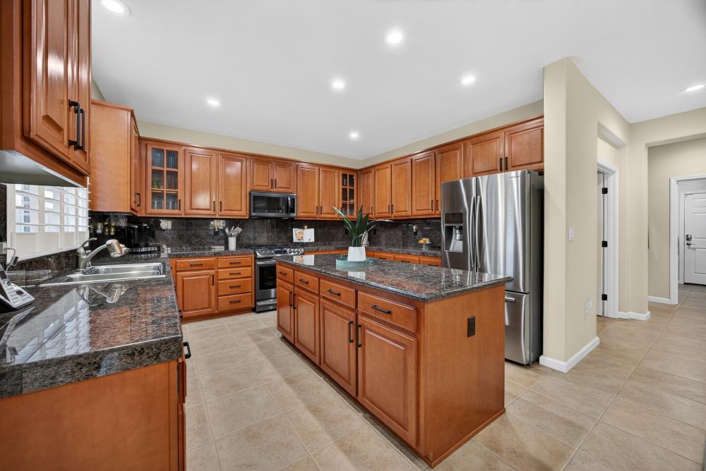 3670 Topaz Road West Sacramento, CA 95691 - Photo 75 of 97 a kitchen with stainless steel appliances granite countertop a stove top oven a refrigerator a sink and dishwasher