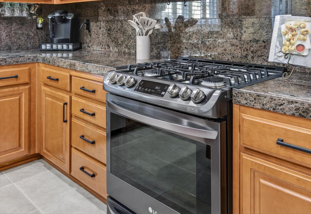 3670 Topaz Road West Sacramento, CA 95691 - Photo 78 of 97 a kitchen with granite countertop a stove and a sink