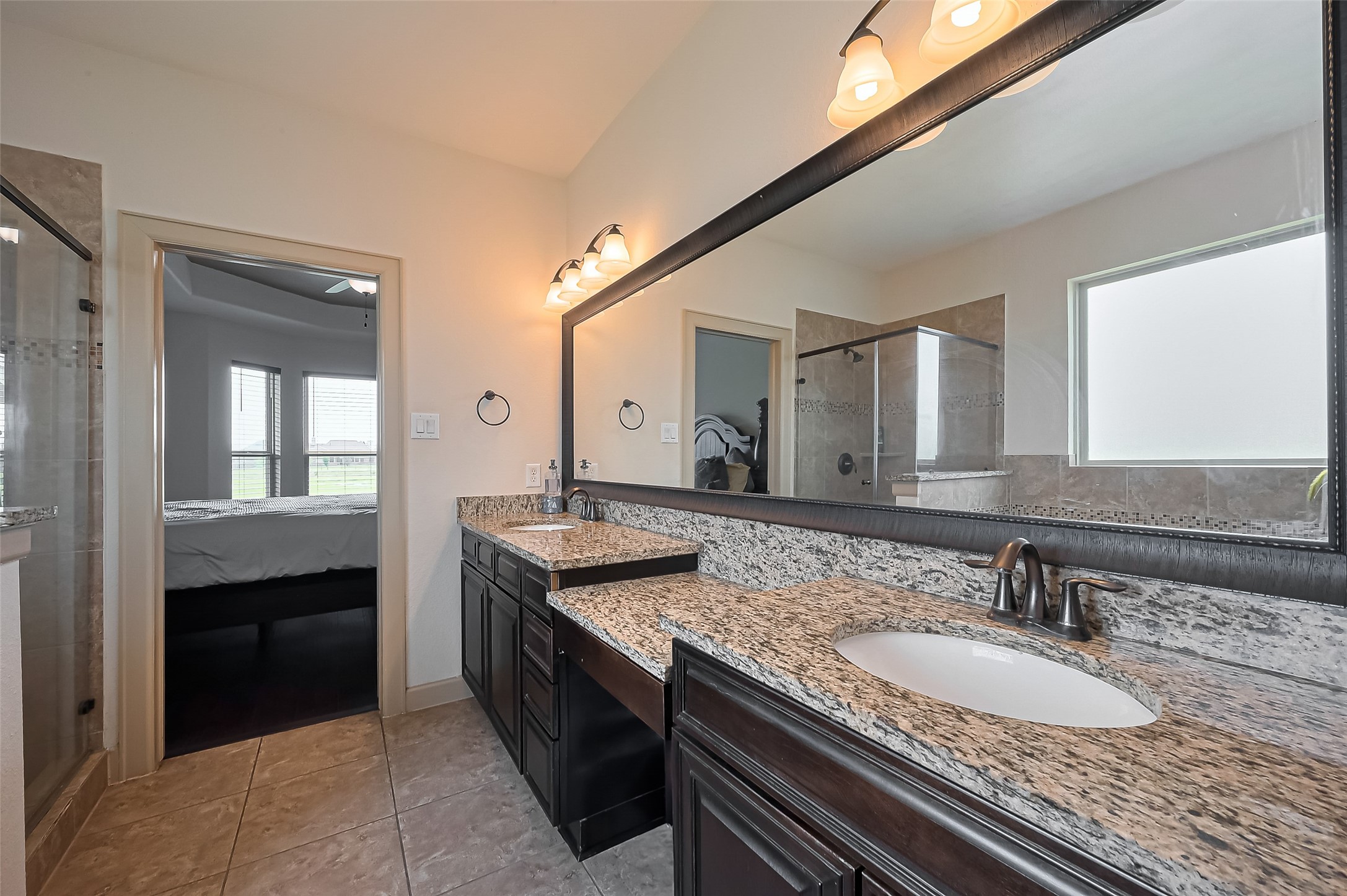 4810 Dubuque Parkway Rosharon, TX 77583 - Photo 20 of 45 a bathroom with a granite countertop sink and a mirror