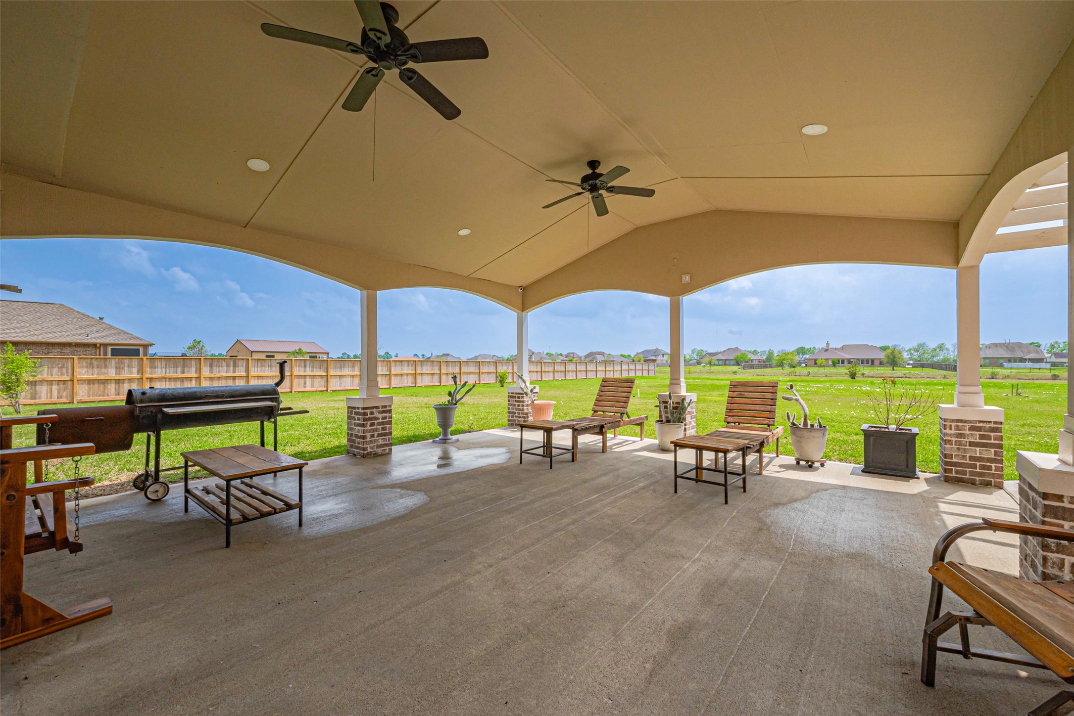 4810 Dubuque Parkway Rosharon, TX 77583 - Photo 34 of 45 a view of a patio with a table and chairs under an umbrella