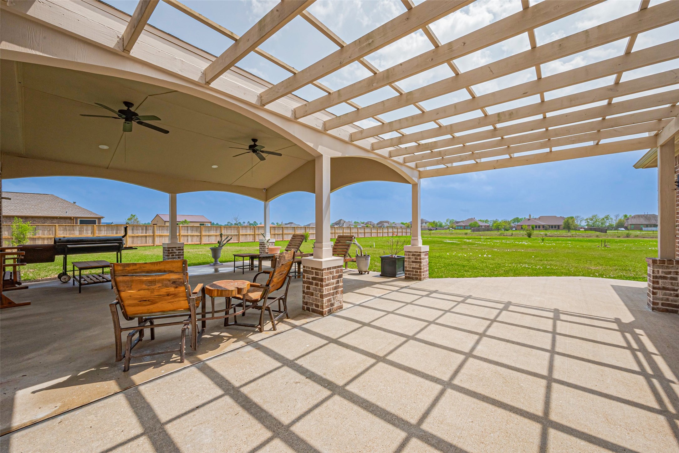 4810 Dubuque Parkway Rosharon, TX 77583 - Photo 35 of 45 a view of a patio with a table and chairs under an umbrella
