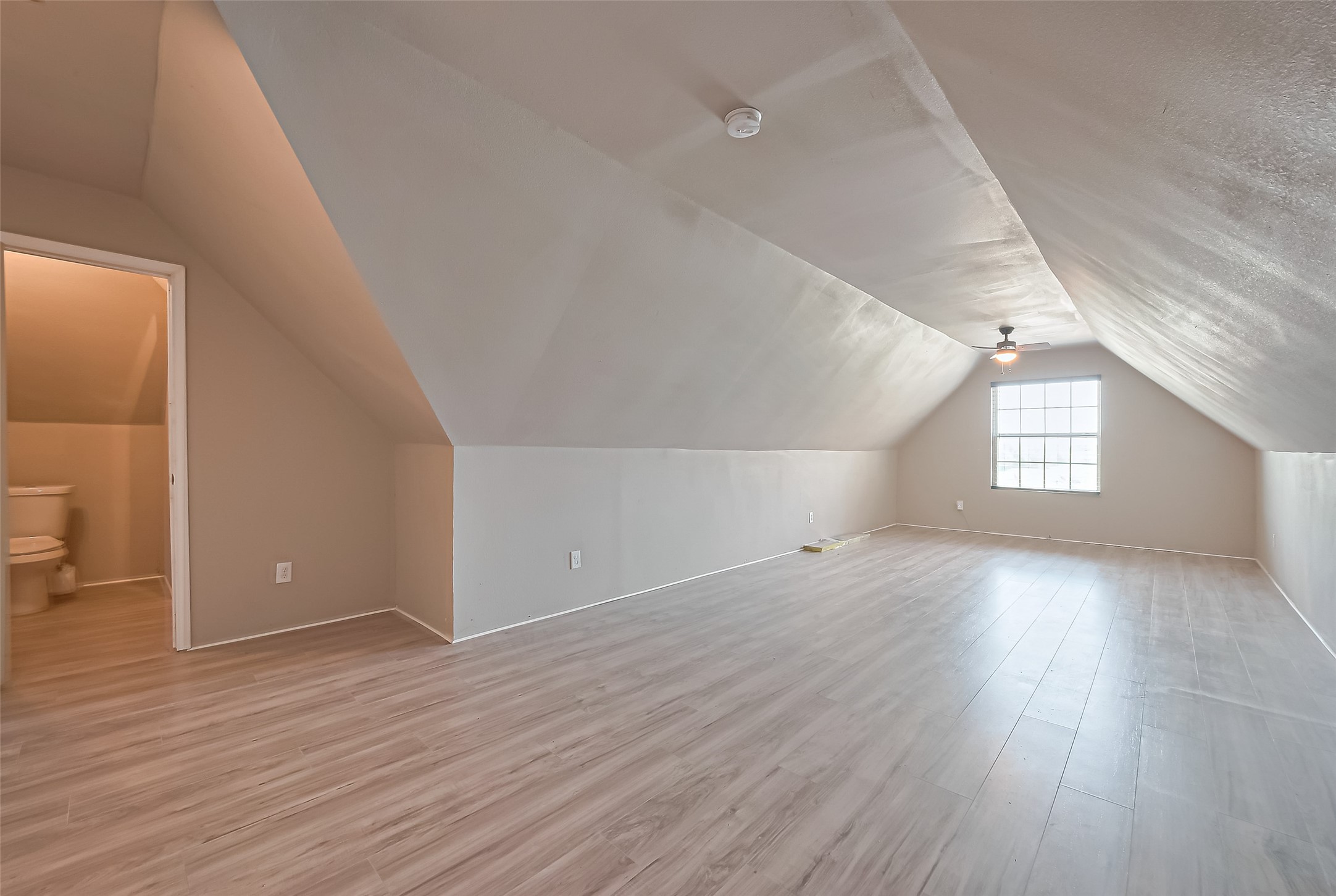 4810 Dubuque Parkway Rosharon, TX 77583 - Photo 37 of 45 wooden floor in an empty room with a window