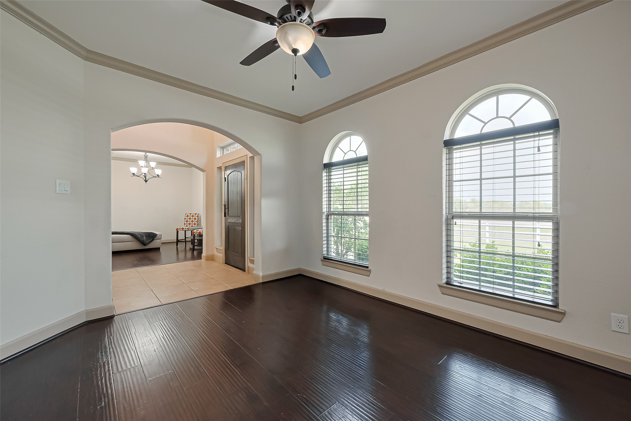 4810 Dubuque Parkway Rosharon, TX 77583 - Photo 10 of 45 an empty room with wooden floor fan and windows