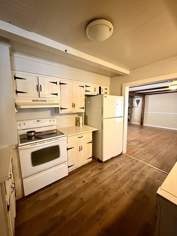 48 Broad Street Rehoboth, MA 02769 - Photo 3 of 19 a kitchen with a refrigerator stove and white cabinets